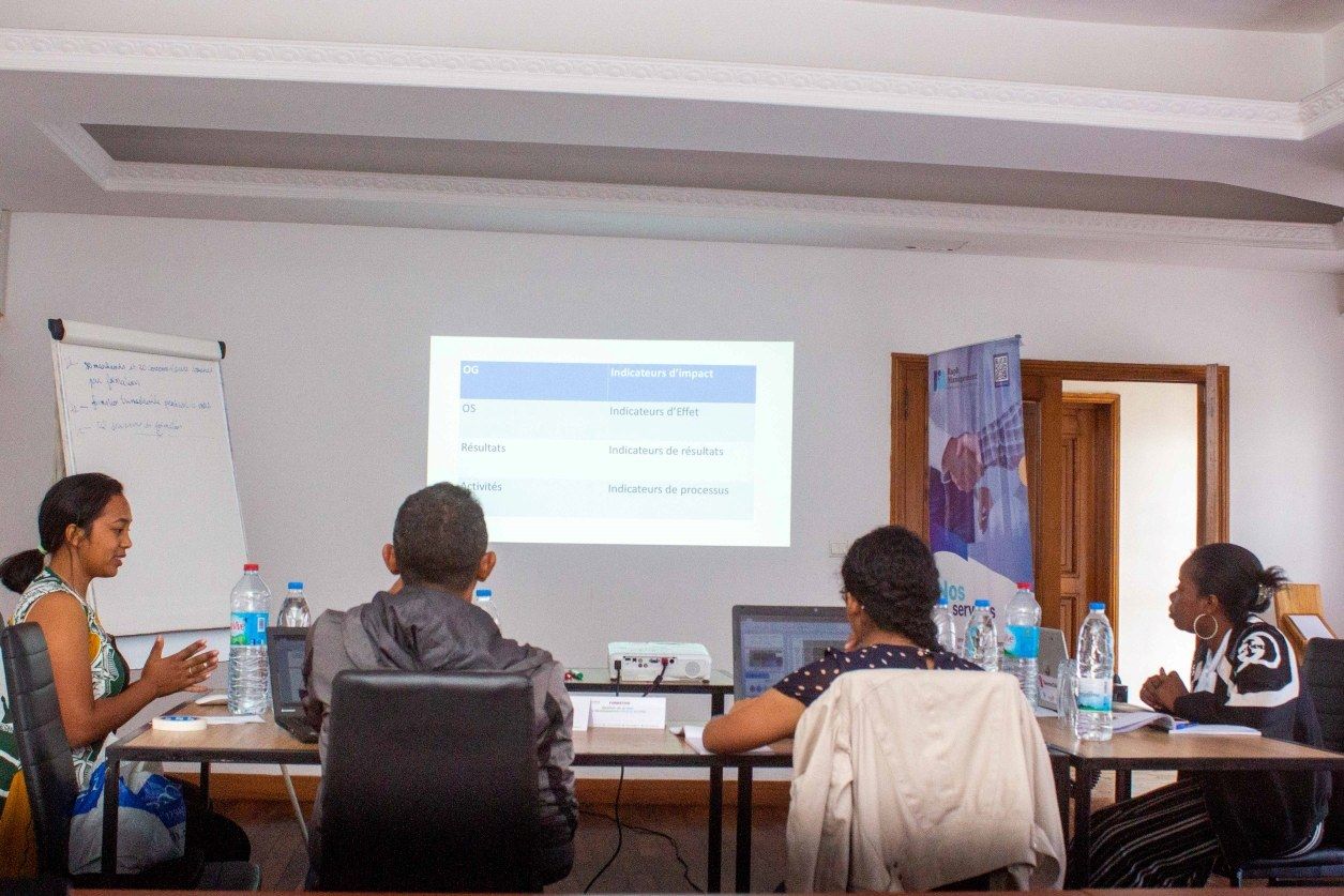 Participants in a workshop around a table